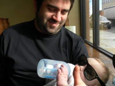 He holds his own bottle now - thumbs up!