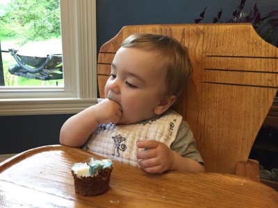 He tries out his birthday cupcake...