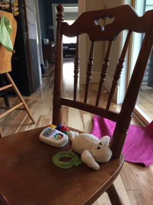 Jack pushes this chair all around the house. He likes to take his toys with him...