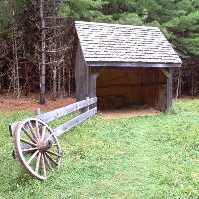 Shed with cart wheel