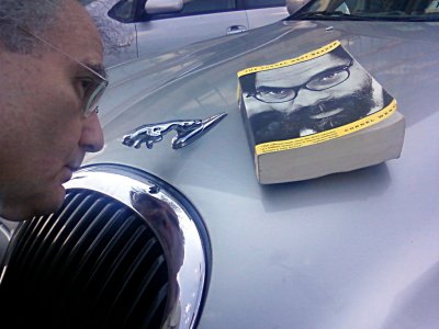 Cornel West book on hood of 2000 Jaguar S-type