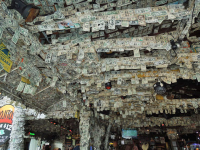 Thousands of dollar bills on the ceiling and walls at Willie T's