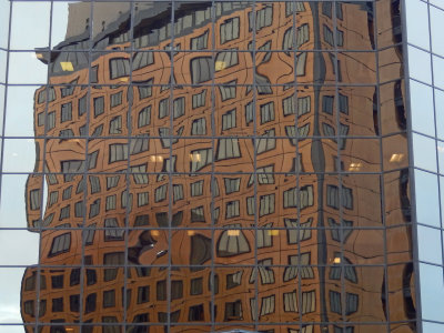 Capt Cook Hotel reflected in glass tower across the street