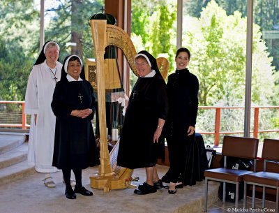 SUMMER JOY: from left, our very own Sr. Regina, Sr. Therese, Sr. Joanne with world-renowned, award-winning concert harpist Anna 