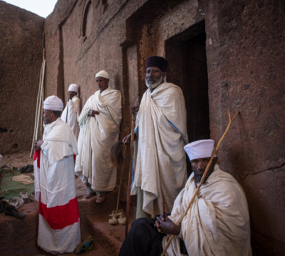 Priests in front of ancient churches in Lalibela