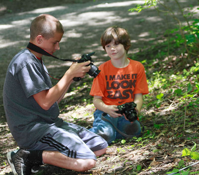 Tyler with Stevo Bowling checking out their photos of a Pygmy Rattlesnake