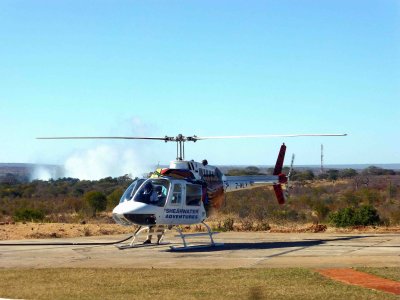 Helicopter with Victoria Falls in the Background