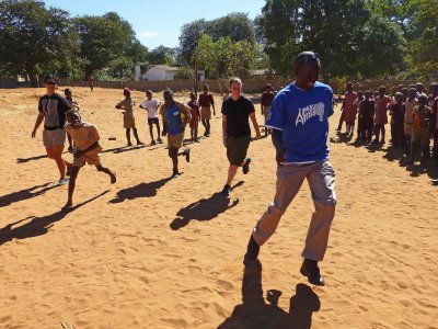 Mermer, Ashley, & Francis Playing Soccer at Chinotimba School