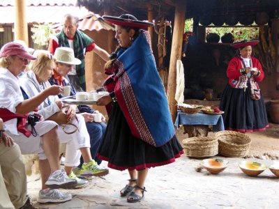 Coca Tea from Girl in Traditional Chinchera Clothing