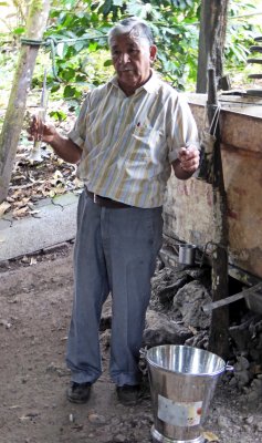 Owner of the Sugar Cane Farm testing Rum