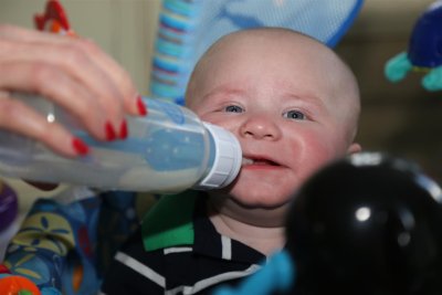 Leo plays with the bottle