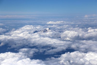 Mountaintop poking through the clouds