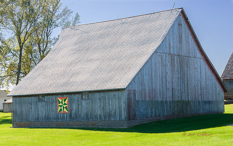 While the barn has a bright spot on it's side a close look at these weathered barn reveals it once has a nice coat of red on it. It is still in good shape although it could use a coat of paint.
An image may be purchased at http://edward-peterson.artistwebsites.com/featured/weathered-barn-edward-peterson.html