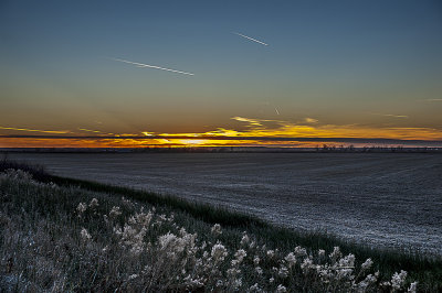 Sunset over the Missouri River reveals a lot of air traffic.
An image may be purchased at http://edward-peterson.artistwebsites.com/featured/missouri-river-sunset-edward-peterson.html