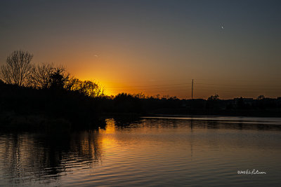 Nothing like a calm lake at sunset on a cool autumn evening.
An image may be purchased at http://edward-peterson.artistwebsites.com/featured/sunset-and-contrails-edward-peterson.html