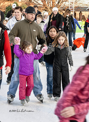 While there were lots of mothers on the ice helping their children, there were also dads out there protecting multiple children at the same time.