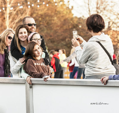 Dad and the daughters getting snapped.