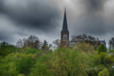 One of the churches near my home town in Iowa. This steeple always stands out in the countryside as you approach the town. As I past by it today I had to stop and grab a quick photo as the rainy sky provided a new backdrop for the church.

An image may be purchased at http://edward-peterson.pixels.com/featured/iowa-small-town-church-edward-peterson.html?newartwork=true