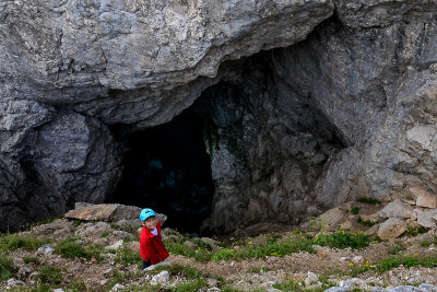 Alex at the entrance to Ledena Pecina (ice cave) 2160m in Obla Glava massif, Durmitor NP 