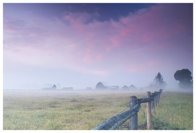 Foggy farm at sunrise