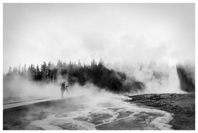 A photographer in the steam