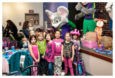 The girls with Chuck E. Cheese