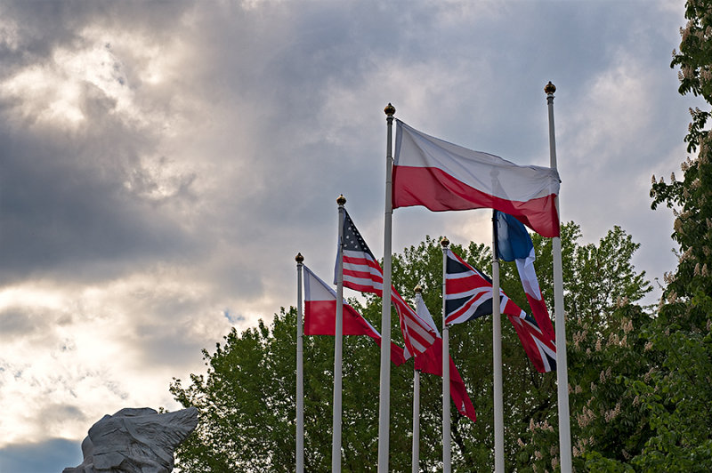 Flags On The Cloudy Sky