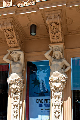 Caryatids With A Poster