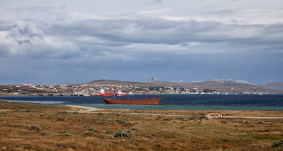 Most of Stanley is in the background and with the rusted 1879 ship Lady Elizabeth in the harbor