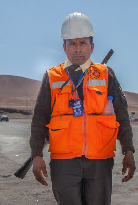 A proud port guard with a very rusty shotgun