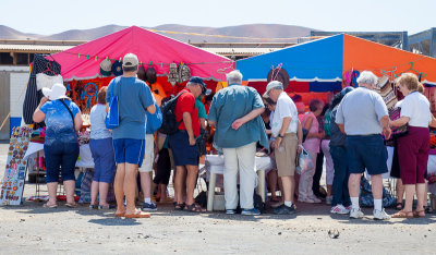 A hoard of non-indigenous persons attracted to trinket tents