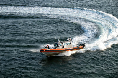 I think the Coast Guard was just showing off playing with their fast boat