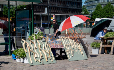 Selling bath brooms or Vihta for use in a sauna. Some look more like bats to me.