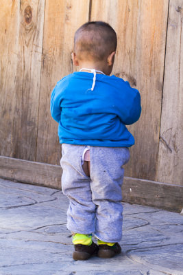 little boy with Bud Crack stands 