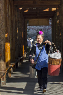 a Miao woman brings her produce to market   