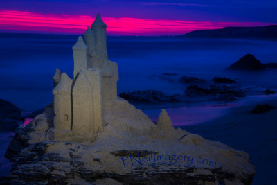 August sand castle sunset