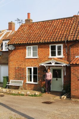 Ruth in front of Grasshopper Cottage