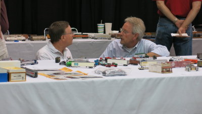 Inspecting models at the model display tables.  Jeff Kuebler is at left.