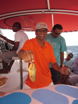 Uncle St. Clair showing one of his catches 