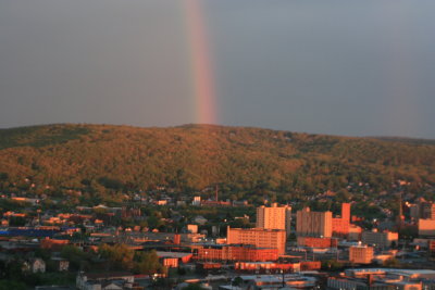 Rainbow photo over city