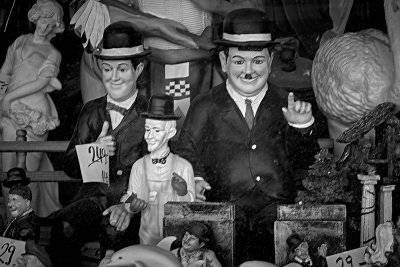 Laurel & Hardy behind a dirty vindue