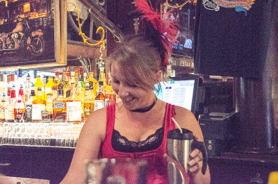 Rebecca serves drinks in Big  Nose Kate's saloon