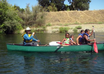 Evan Massaro with Four Girl Scouts on the American River