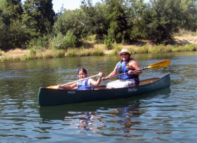 Denise Lloreda with a Girl Scout on the American River