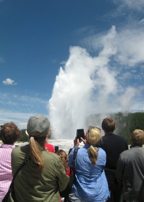 Lisa Observing Old Faithful at Yellowstone National Park