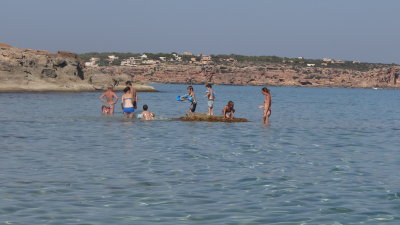 Three French families enjoy the shallow water on the Tramuntana coast