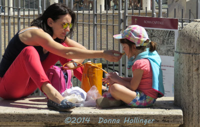 A Mother Feeding her daughter impromptu lunch