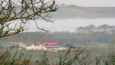 Farmhouse  just  missing  out  on  mist.