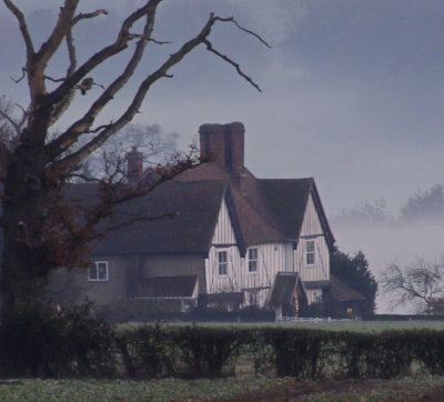 C 16th century , Grade II ,Hill  Farmhouse , on  a  misty  evening.