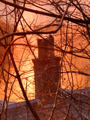 The  cottage  chimney  caught  by  the  rising  sun.